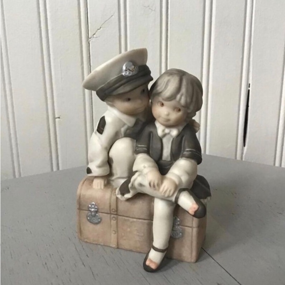 1997 Enesco “our love keeps me afloat “ figurine